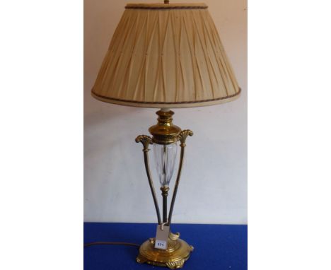 A heavy brass and crystal table lamp with pleated shade, the fluted crystal centre flanked by two scrolling uprights 