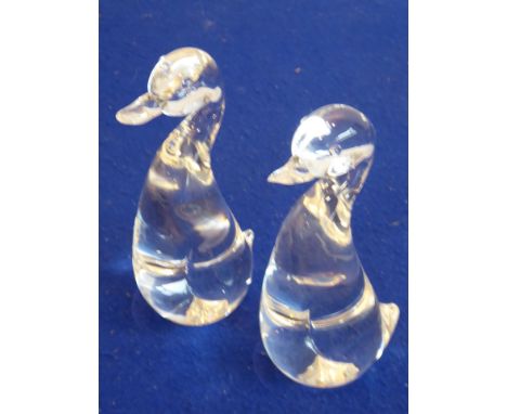 A pair of clear glass models of standing ducks, each signed Steuben (American Art Glass Manufacturer), to the underside, 19.5