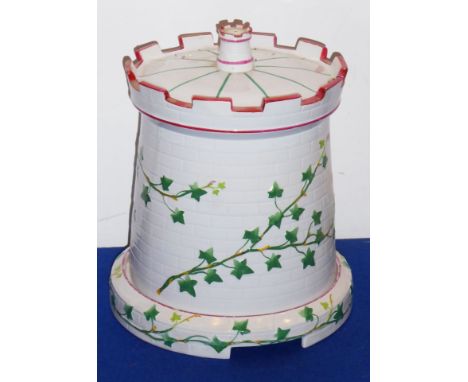 A 19th century ceramic stilton dish and cover modelled as a castellated turret with trailing ivory; diamond registration loze