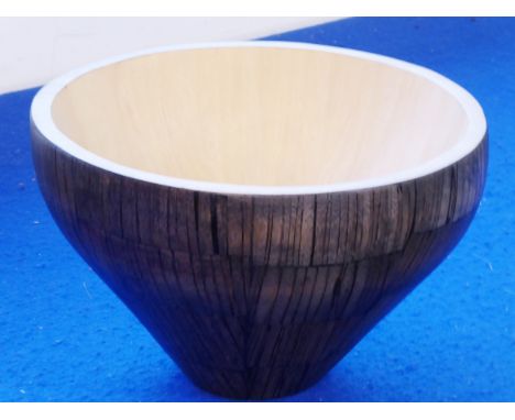 R &amp; Y Augousti (Paris), a natural and stained wood sectional conical-shaped wooden bowl, signed (modern), 24.5cm in diame