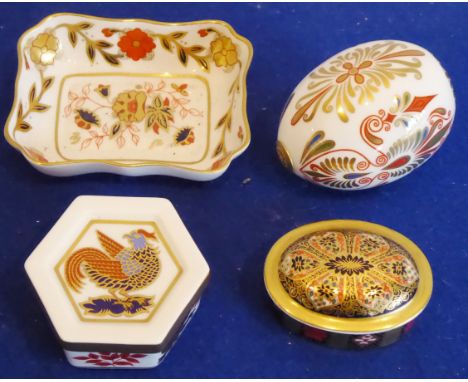 A Royal Crown Derby group to  include a small rectangular trinket tray (9.5cm), an elaborately decorated egg, a hexagonal tri