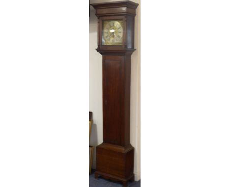 An antique (mostly 18th century) oak-cased longcase clock; the flaring cornice above an 11" brass dial with silvered chapter 