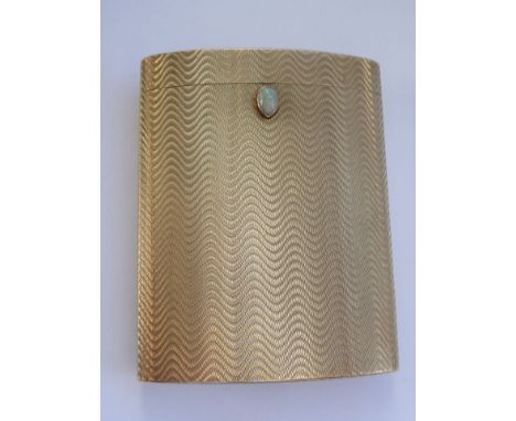 A fine 9-carat yellow gold case with hinged cover, unusual 'wavy' engine-turned decoration and the clasp with a firey cabouch