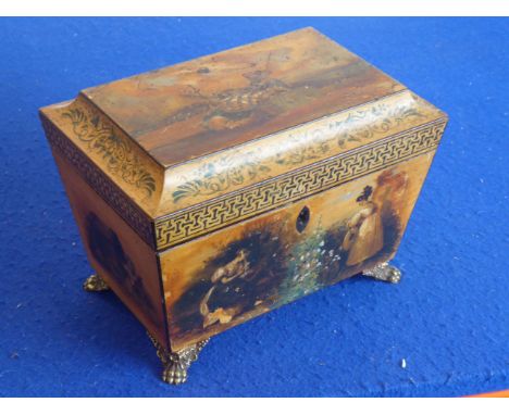 An early 19th century sarcophagus-shaped painted maple tea caddy; raised on four gilt-metal  paw-style feet, 22cm wide