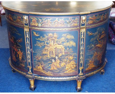 An early/mid 20th century demi-lune side cabinet profusely hand-gilded and lacquered with chinoiseries; the top with a gilded