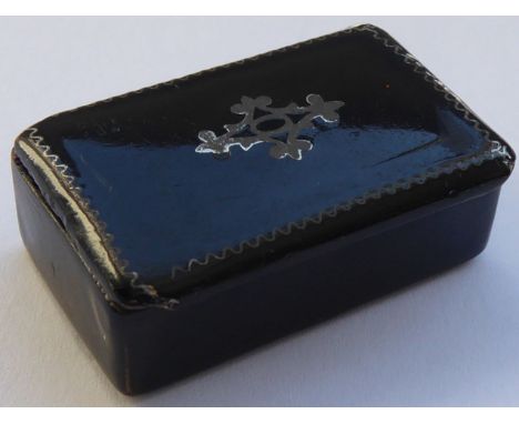 A small 19th century black papier-mâché and pewter inlaid snuff box 