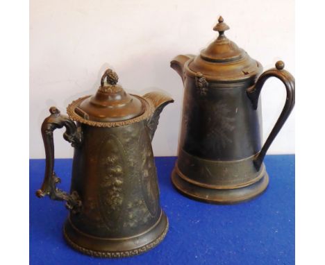 Two 19th century pewter hot water jugs (one ceramic lined); each typically decorated in late 19th century style with ferns an