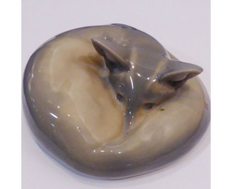 A Royal Copenhagen model of a recumbent fox curled up; printed and painted marks to underside, 17cm diameter  CONDITION REPOR