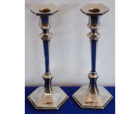 A pair of early 20th century hallmarked silver hexagonal table candlesticks, London assay marks, 20cm  CONDITION REPORT: Thes