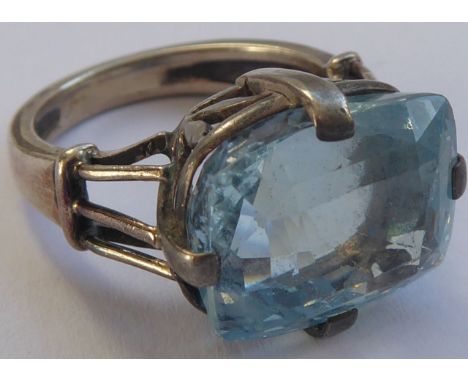 A white metal ring set with a large hand-cut light-blue stone (possibly aquamarine/zircon), total weight approx. 6.78g  CONDI