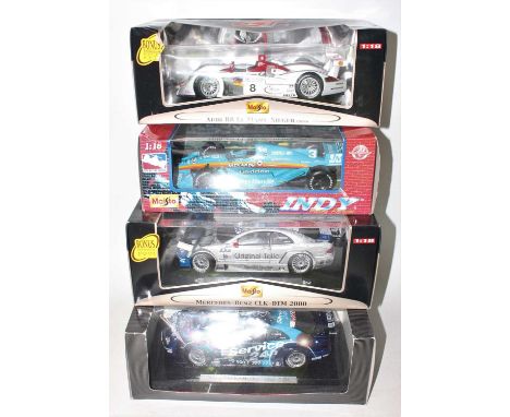 A group of 4x 1:18 scale Race cars as follows: Maisto Audi R8 Le Mans, Indy race car, Mercedes Benz CLK-DTM 2000 plus a AMG M