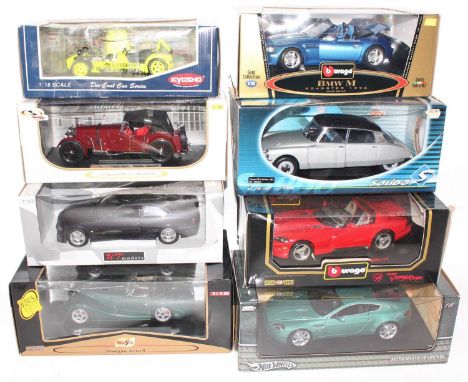 A group of 8 mixed 1:18 scale cars by various manufactures to include a Kyosho "Caterham Super 7", Solido Citreon DS19 and ot