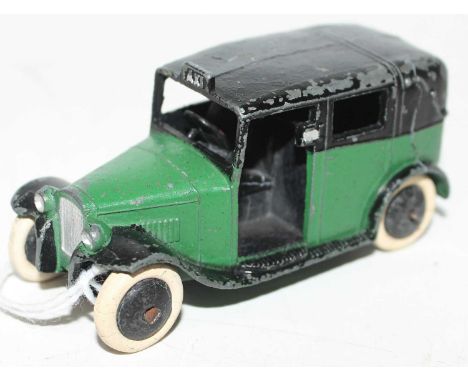 Dinky Toys, No.36g Pre-war Taxi, green body, black chassis, open rear window, smooth black cast hubs, white tyres - rear axle