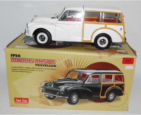 A Sunstar 1/12 scale limited edition model of a 1956 Morris Minor Traveller, finished in white and housed in the original pol