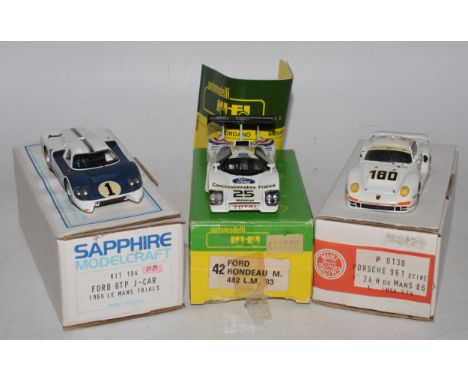 Three various boxed 1/43 scale white metal and resin race cars, all built to a very good standard, to include a Mini Racing K