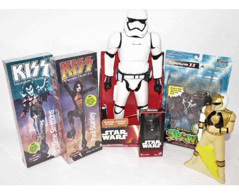 A collection of mixed TV and music related action figures and plastic kits, to include a Kiss - Gene Simmons, and Paul Stanle