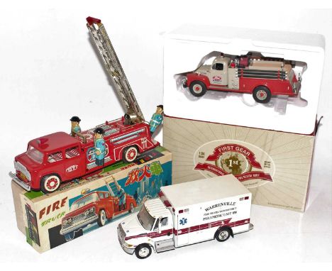 Three various boxed and loose diecast and tinplate fire service vehicles to include a First Gear 1/34 scale model of an Inter