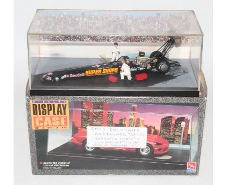 An SMTS 1/43 scale kit built model of a Don Garlits rear engined top fuel dragster, housed in a plastic and perspex display c