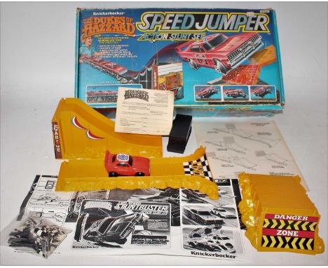 A Knickerbocker boxed The Dukes of Hazzard action stunt set, comprising of plastic ramp and various sections, a Dukes of Hazz