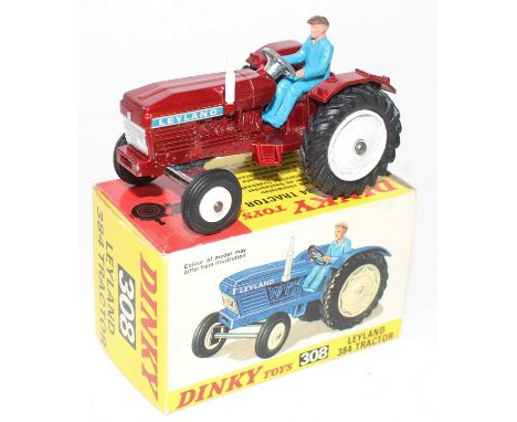 A Dinky Toys No. 308 Leyland 38F tractor comprising of metallic red body with white hubs and driver figure housed in the orig