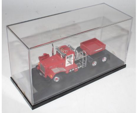 An IMC Models 1/50 scale resin cast model of a Mammoet Kenworth 8483 axle commercial vehicle finished in red, white, and blac