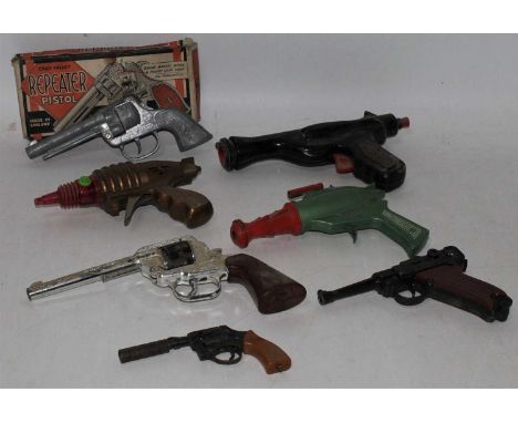 Small group of 7 toy guns includes a boxed Chad Valley Repeater pistol and three space guns all in used condition.