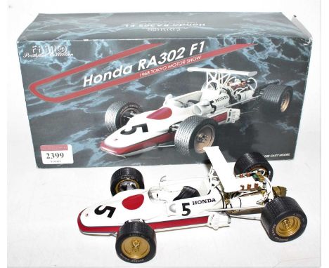 An Ebbro Premium Collection 1/20 scale diecast model of a Honda RA302 F1 1968 Tokyo Motor Show race car, housed in the origin