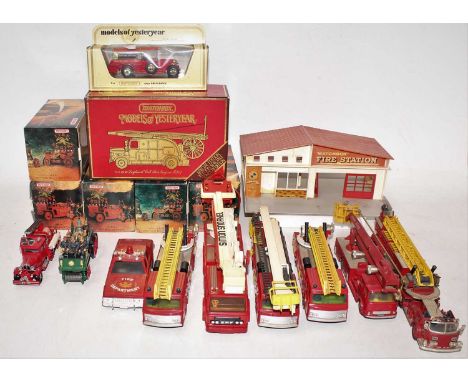 A collection of boxed and loose Matchbox, Corgi and other fire service vehicles and accessories, to include a Matchbox fire s