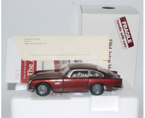 Danbury Mint 1/24th scale 1964 Aston Martin DB5 in wine red, complete with polystyrene packing and outer box plus all paperwo