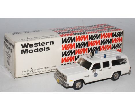 A Western Models No. K3 1/43 scale kit built model of a Chevrolet C10 suburban police car, finished in white with blue roof l