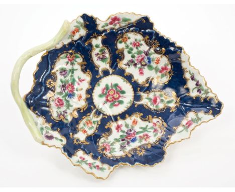 18th century Worcester leaf-shaped dish with painted floral reserves within gilt cartouches on blue scale ground with green s