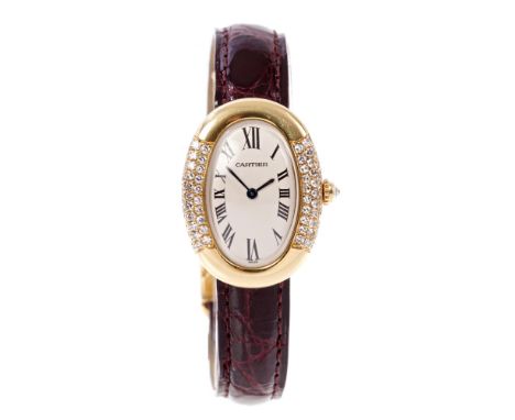 Fine Cartier ladies' gold (18ct) Baignoire diamond set wristwatch with curved oval dial with black enamel Roman numerals with