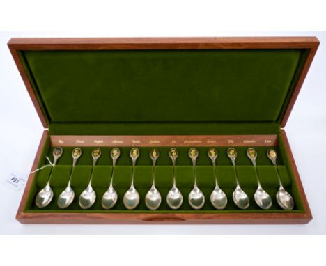 Set of twelve contemporary silver Fellowes edition Royal Horticultural Society flower spoons inset with twenty-four carat gol