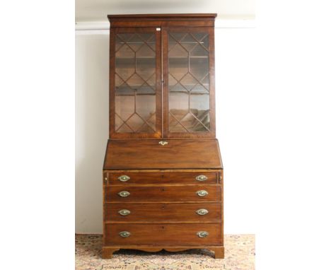 George III mahogany bureau bookcase with moulded cornice and adjustable shelves enclosed by a pair of astragal glazed doors, 