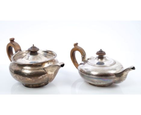 George III silver teapot of compressed baluster form, with flared gadrooned rim, fruitwood scroll handle, domed hinged cover 