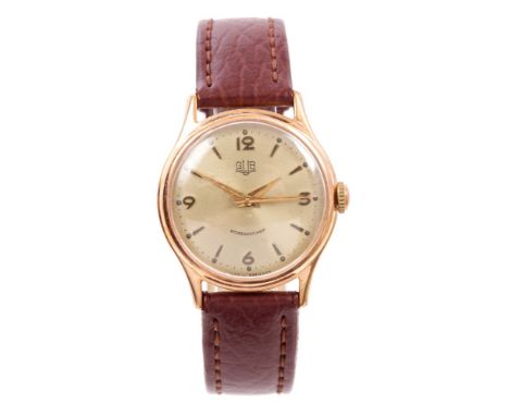 Rare 1950s East German Gub Glashutte wristwatch with engine-turned circular dial, applied Arabic and spear-head hour markers,