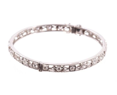 Diamond set hinged bangle, the openwork design set with twenty-five brilliant cut diamonds estimated to weigh approximately 2