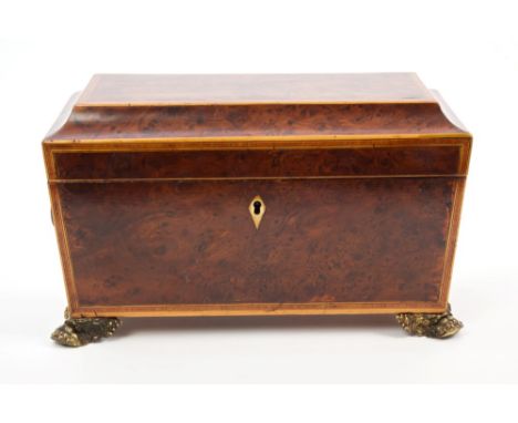 Fine George IV yew wood boxwood strung and tulipwood crossbanded tea caddy of framed sarcophagus form, with flanking lion mas