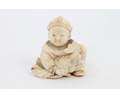 Early 20th century Japanese ivory netsuke modelled as a seated child holding a chicken, 5cm high