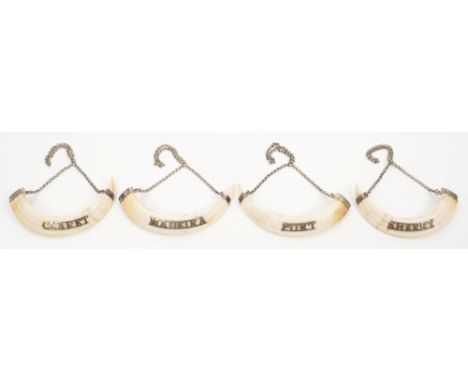 Set of four late 19th century Indian boar's tooth decanter labels with white metal mount and chains and pierced Sherry, Port,