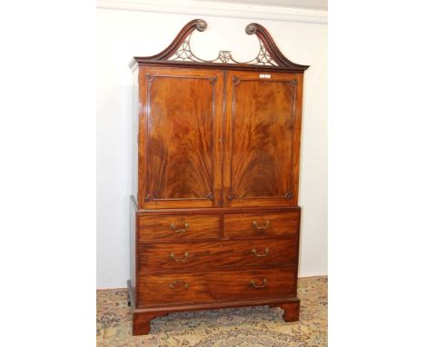 Good George III mahogany linen press, the dentil cornice with lattice pierced broken arch pediment, the upper section of slid
