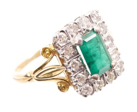 Emerald and diamond cluster ring, the rectangular step cut emerald measuring approximately 8.10mm x 5.25mm x 3.30mm, surround