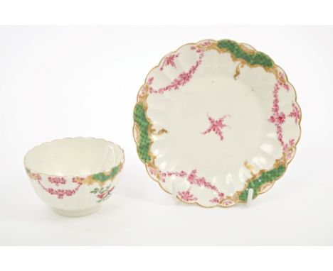 18th century Worcester Sèvres-style fluted tea bowl and saucer with painted birds and floral swags.  Provenance:  Ex-Zorensky