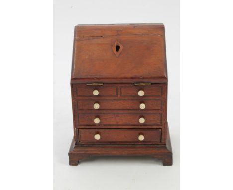 19th century mahogany miniature novelty bureau-form money box, with hinged fall and faux drawer front above concealed compart