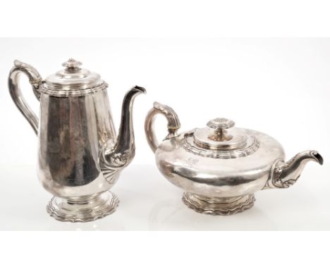 William IV silver teapot of compressed form, with wavy borders, engraved armorial crest, domed hinged cover with similarly de