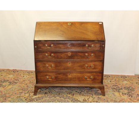 George III mahogany bureau with fitted interior about central cupboard door and four graduated drawers below, on splayed brac