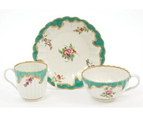 Rare 18th century Worcester fluted trio with green and gilt borders and polychrome floral sprays.  Provenance:  Ex-R. David B