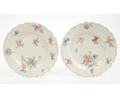 Pair 18th century Worcester Giles polychrome painted plates decorated with floral sprigs and sprays and with fluted borders, 