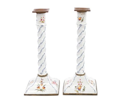 Pair of 18th century Staffordshire enamel candlesticks, each with associated square brass sconce, on wrythen column and squar