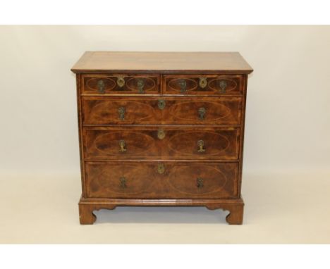 Good early 18th century walnut and boxwood line-inlaid chest of drawers, the projecting crossbanded top with geometric line i